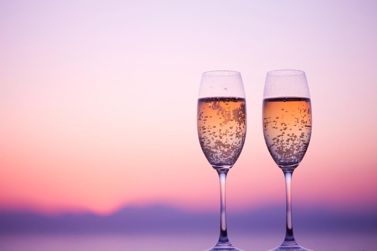 Two glasses of champagne illuminated in the sunset at north myrtle beach