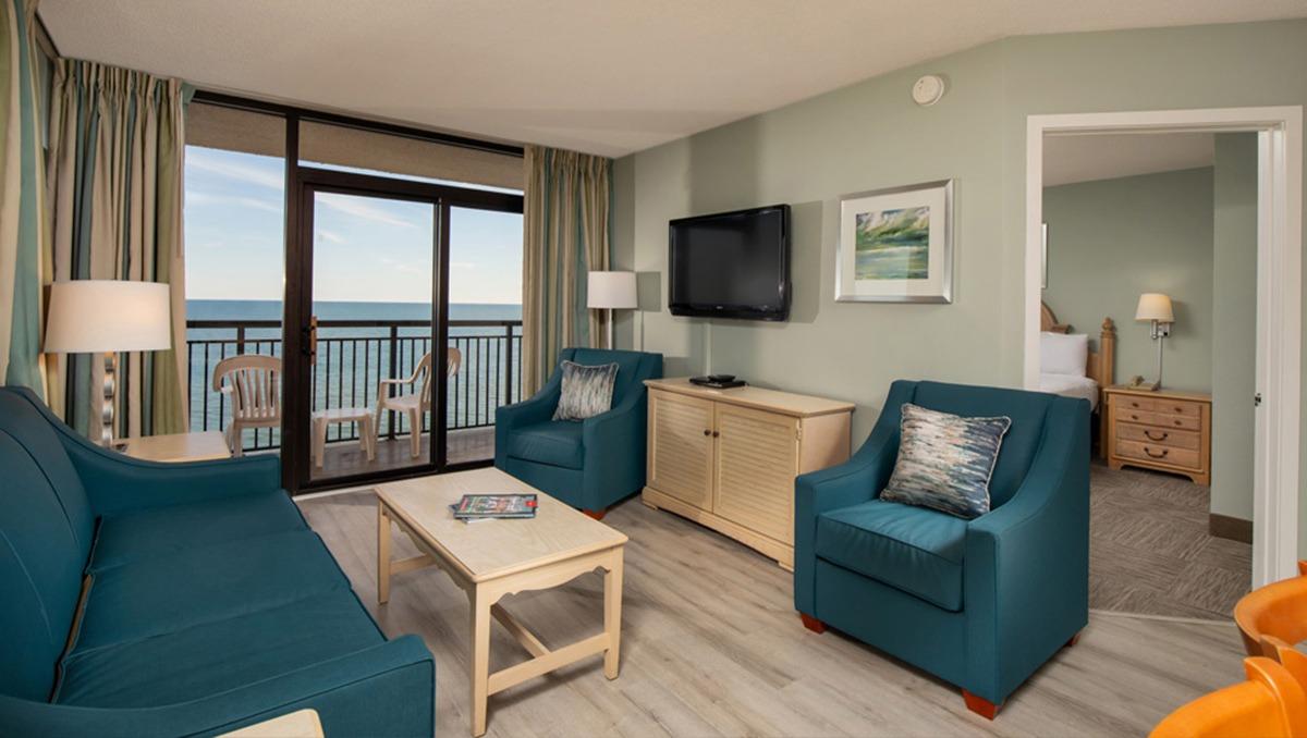 furnished living room area of a three bedroom condo at grande shores