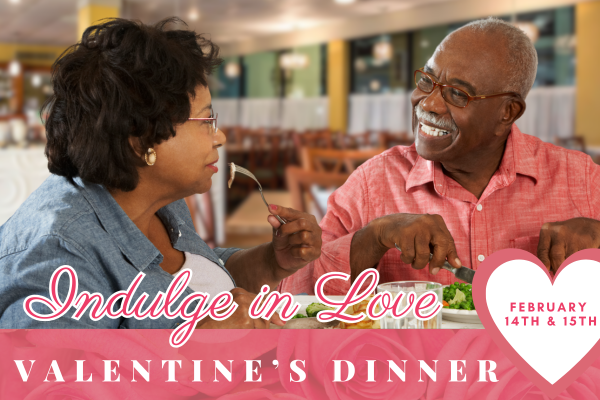 Smiling couple eating dinner at a restaurant