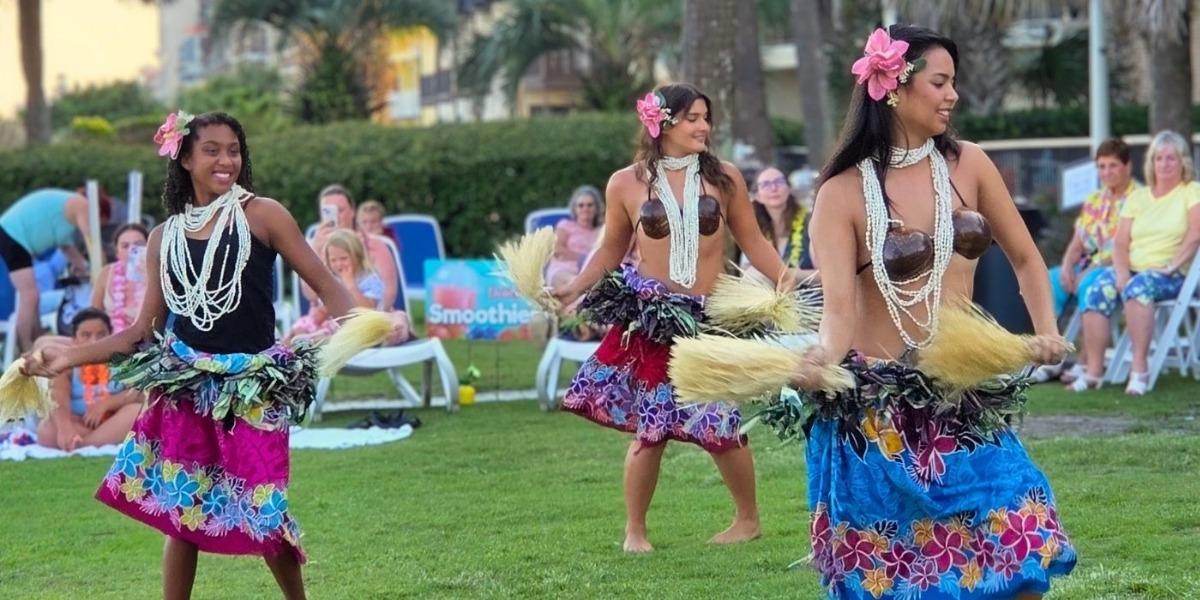 Image of three hula dancers performing at Grande Shores Ocean Resort