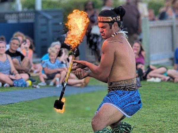 Image promoting Grande Shores Ocean Resort's Myrtle Beach luau show with fire dancers and hula performers