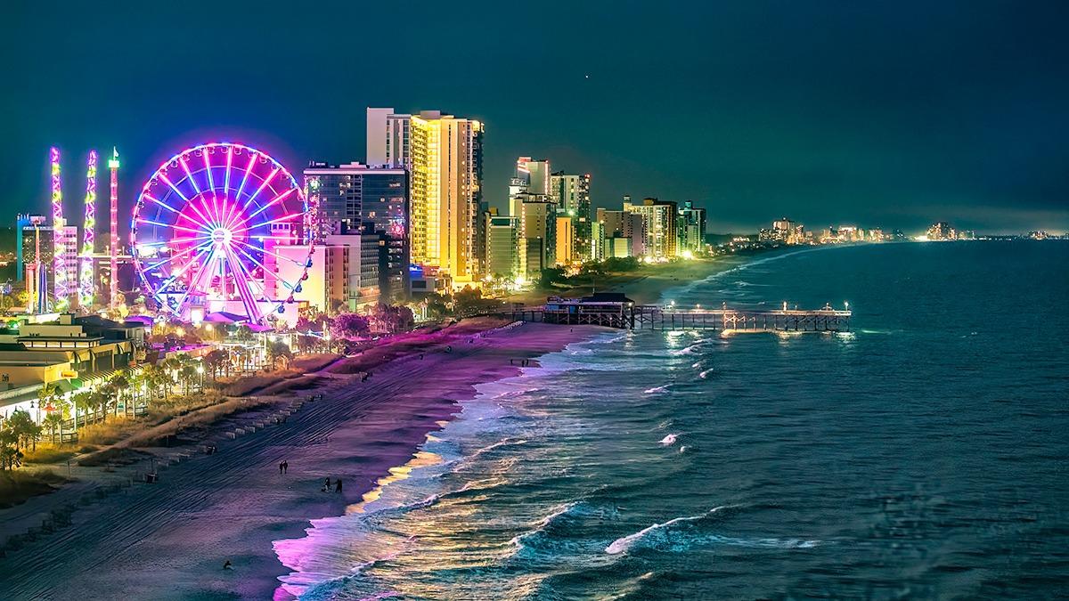 Aerial view of the Myrtle Beach coastline and skywheel at night