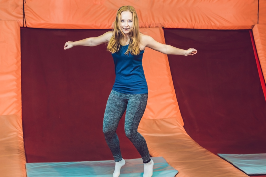 girl jumping on trampoline